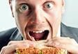 Funny business man eating sandwich