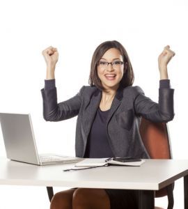 happy young businesswoman with the winning gesture