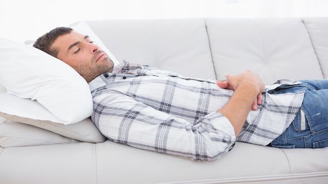 A man lying on the sofa