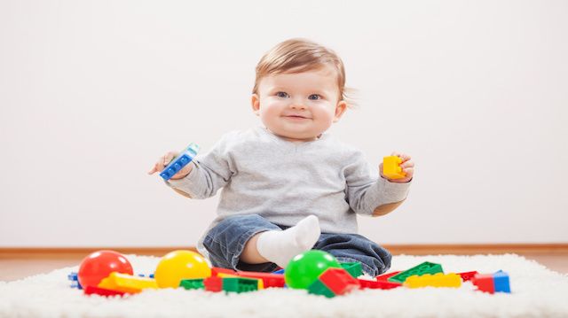 Little boy playing with blocks