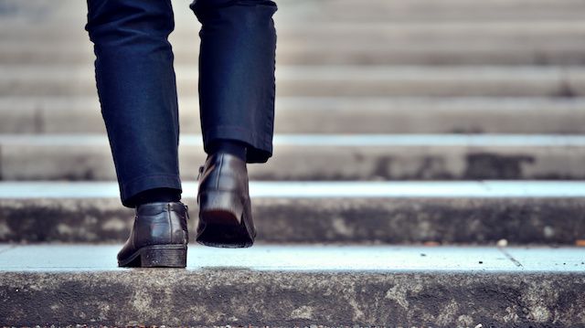 Man advancing up the stairs