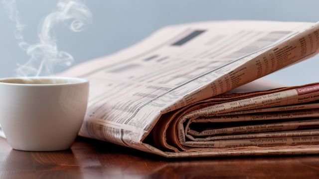 Newspaper and coffee