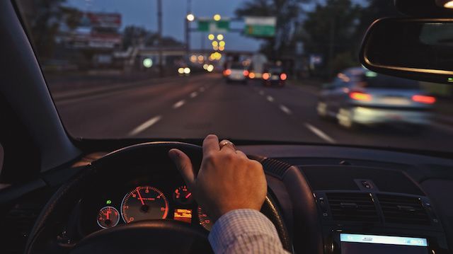 Driving the car around town by night