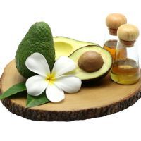 Avocado oil on wood background