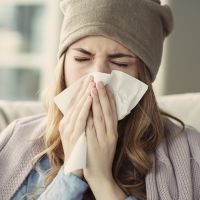 Young woman suffering from cold